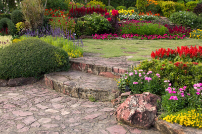 Garden featuring a mix of flowers that flourish in the homeowners plating zone. 